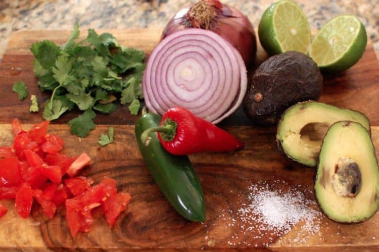 Food on the cutting board, with Guacamole and Kitchen