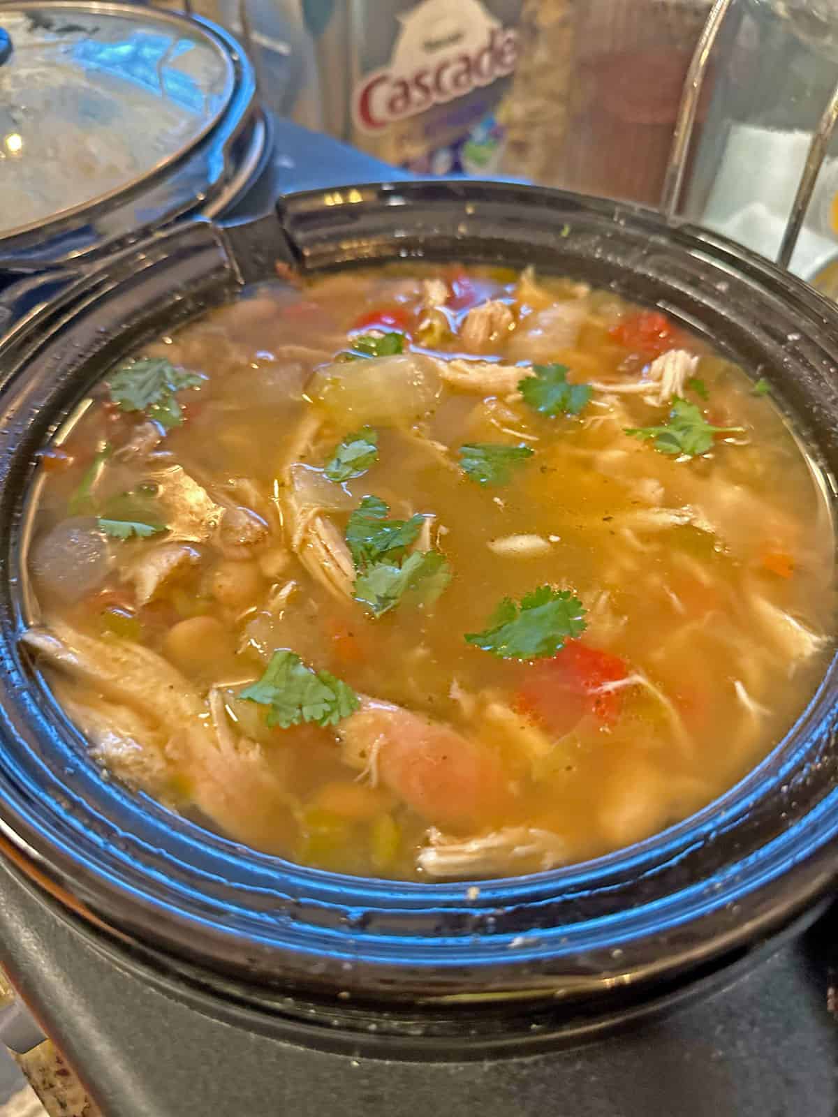 A crock of broth-based white chicken chili.
