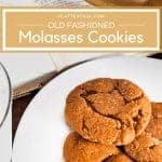 Plate of molasses cookies on a white plate with a rolling pin and the Mennoniter Community Cookbook