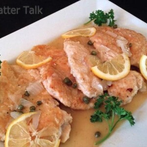 A plate of food with chicken piccata