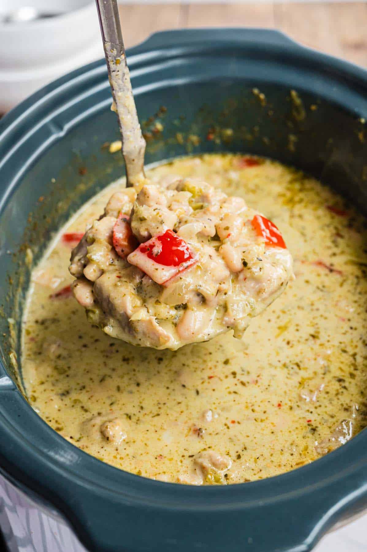 A ladle of white chicken chili.