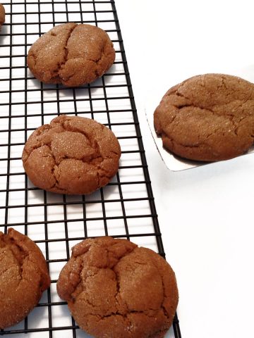 Molasses cookie on a cooling rack.