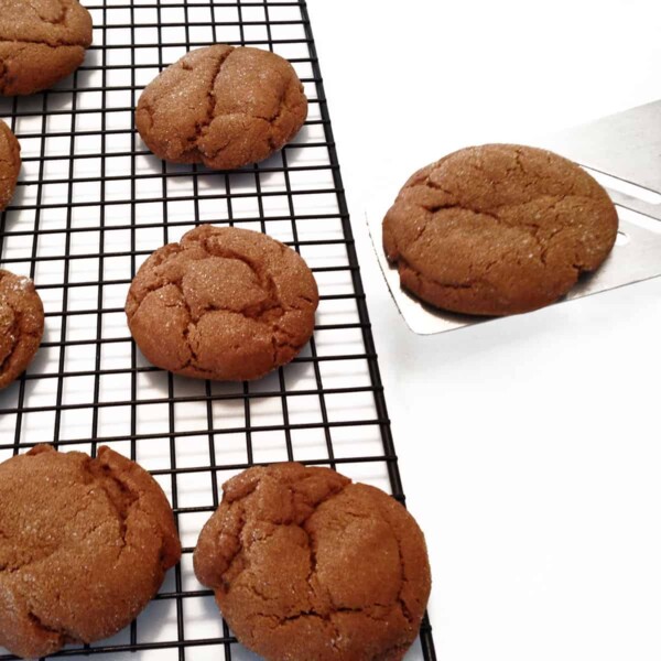 Molasses cookie on a cooling rack.