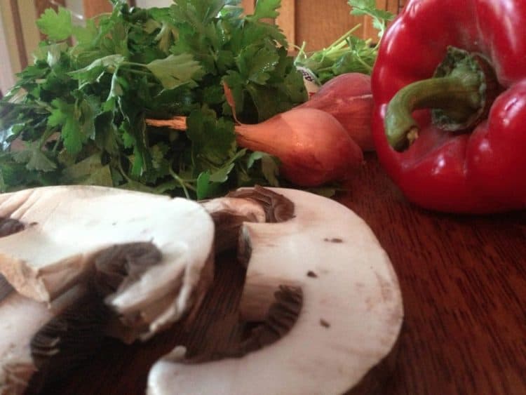 Mushrooms and other vegetables on a cutting board