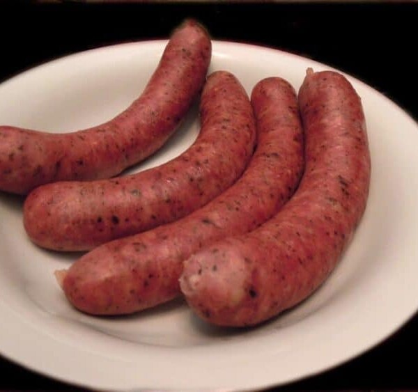 A close up of food on a plate, with Sausage