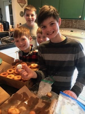 Group of boys making donuts