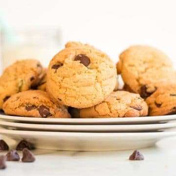 Plate of mint chocolate chip cookies garnished with chocolate chips.