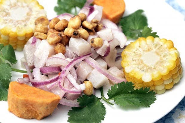 A plate of food, with Ceviche and Sweet potato