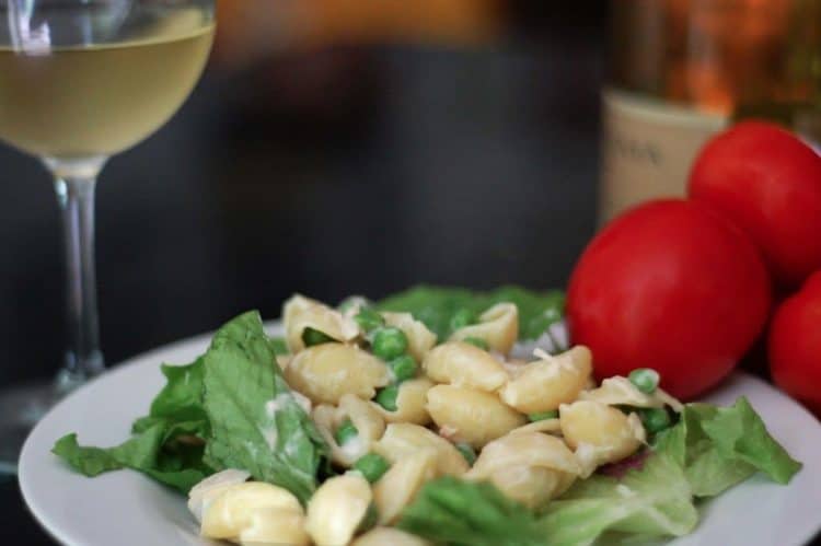 A plate of food and a glass of wine, with Salad and Recipes