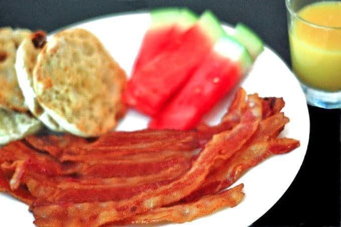 A close up of a plate of food, with bacon