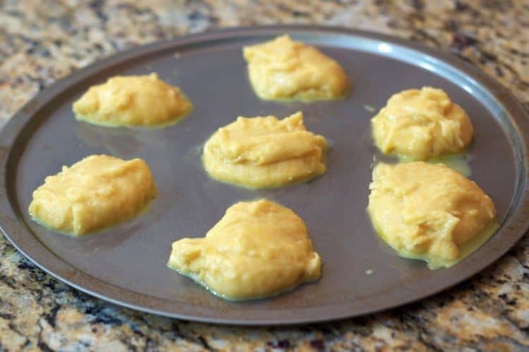 A baking sheet with unbaked dough on it