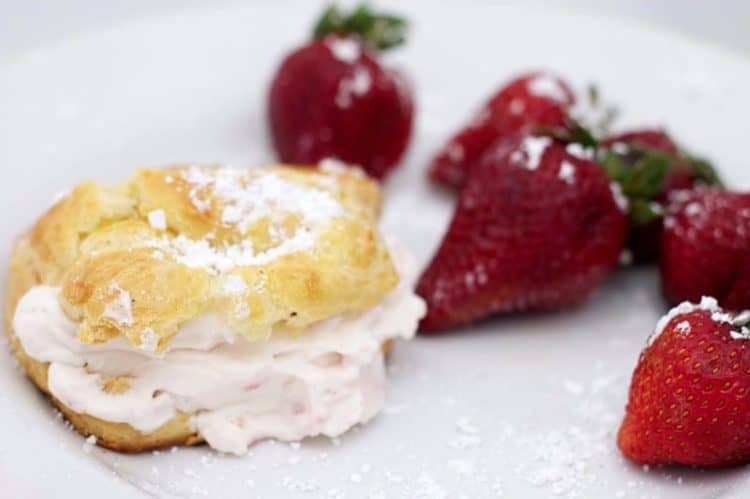 A closeup of food on a plate with strawberries