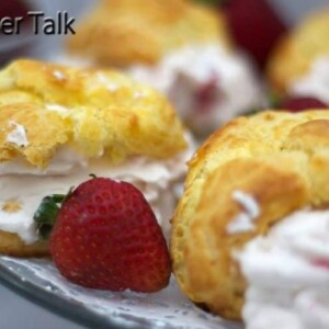 A close up of strawberry cream puffs