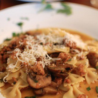 A plate of food, with Mushroom and Pasta