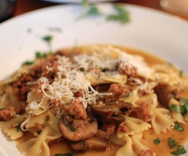 A plate of food, with Mushroom and Pasta