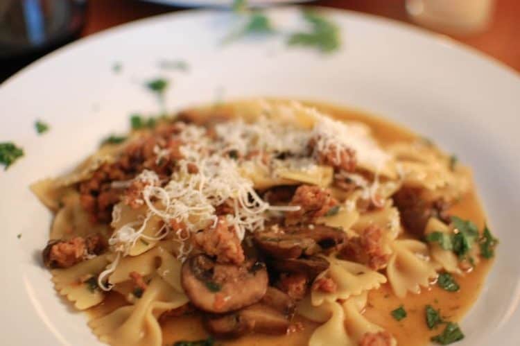 A plate of food, with Mushroom and Pasta