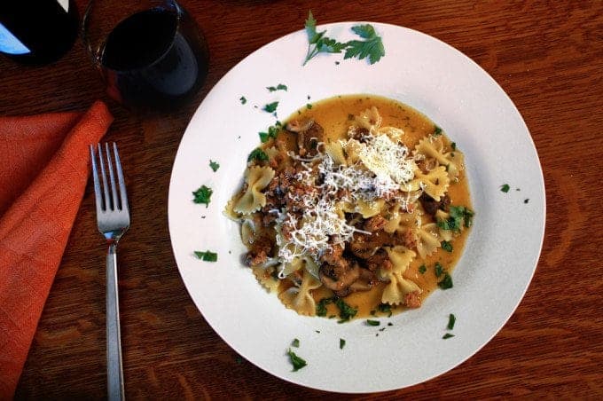 A plate of food on a table, with Mushroom and Pasta