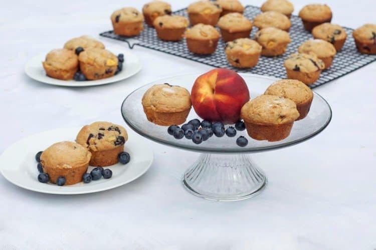 Muffins on a serving platter with a peach