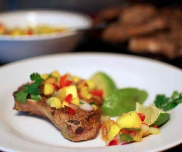 A close up of a plate of food on a table, with Pork and Salsa