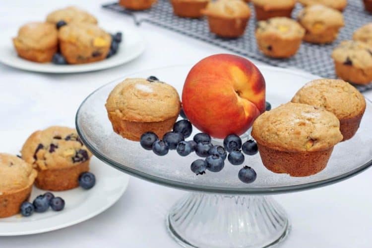 A plate of food on a table, with Peach and muffins