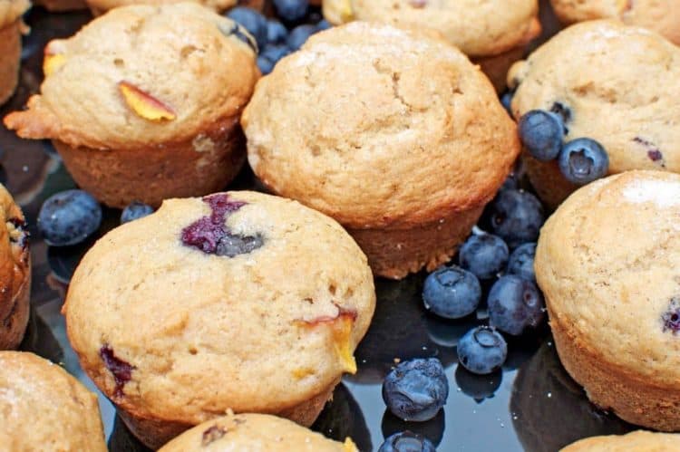 A close up of food, with muffins and blueberries