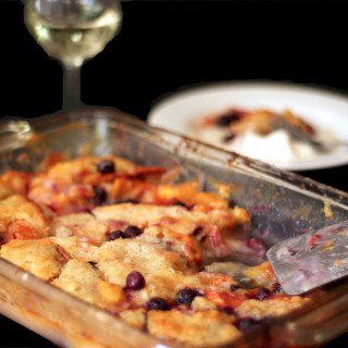 A baking dish filled with peach cobbler