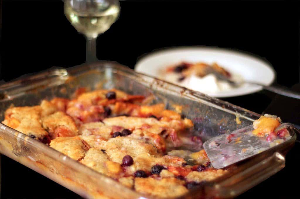 A baking dish filled with peach cobbler