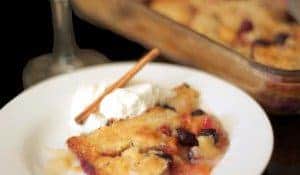 A plat of peach cobbler with ice cream