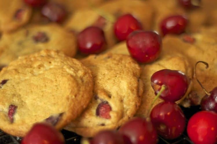 A plate of food with Cookie and Bing cherries