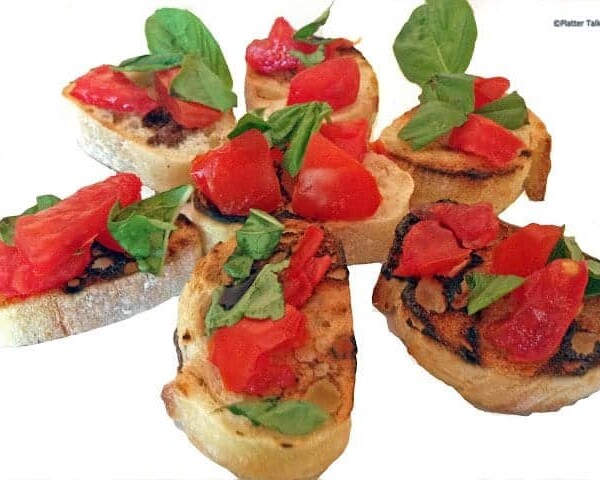 A close up of bruschetta on a plate.