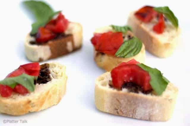 A piece of food, with bruschetta.