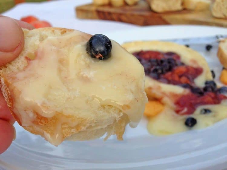 A close up of food on a plate, with Brie and Bread