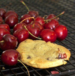 Bing cherries with a cookie on a cooling rack