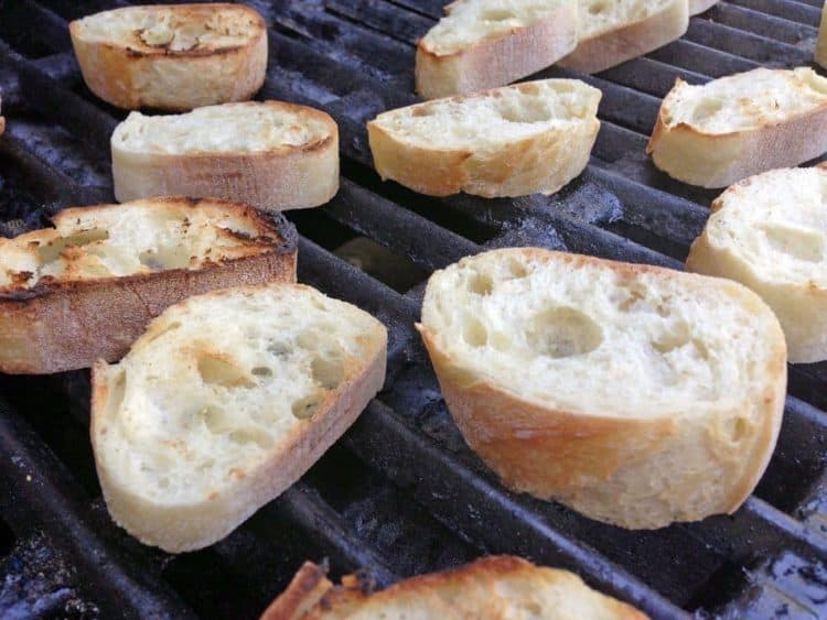 Some small pieces of bread on the grill.