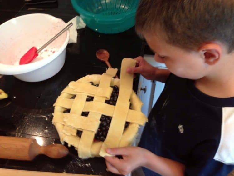 A boy making a pie