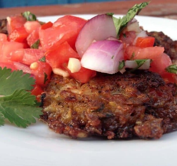 A plate of food, with lentil cake