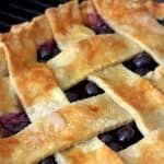 A close up of a blueberry pie