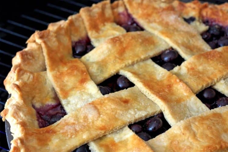 A close up of a blueberry pie