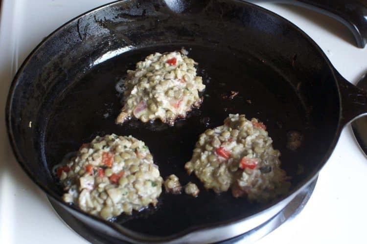 Frying lentil burgers in a skillet