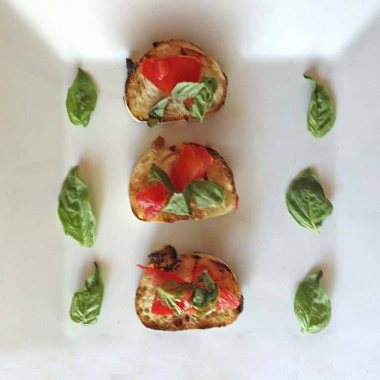 A close up of food, with Bruschetta and Tomato