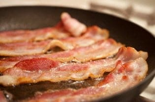 bacon cooking in a pan