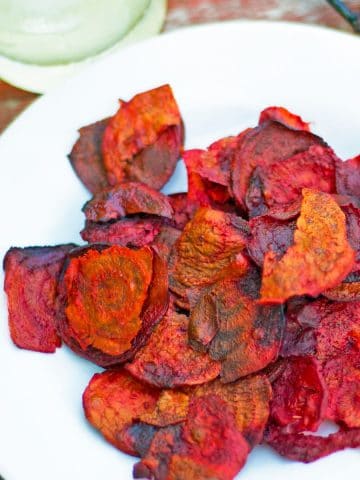 A plate of beet chips.