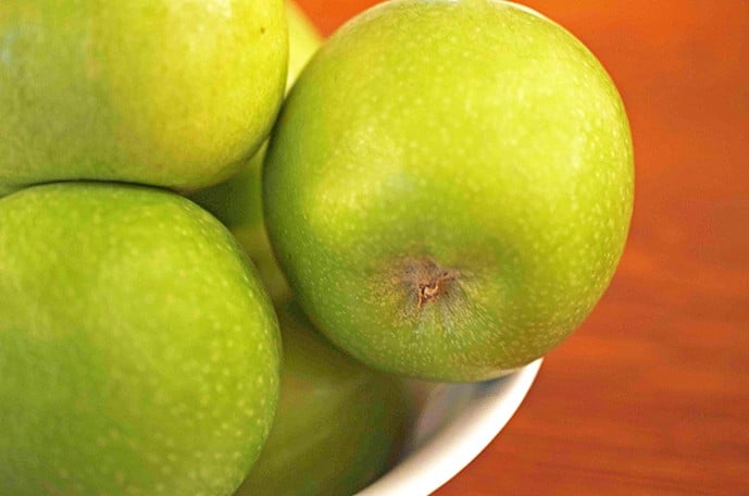 Green apples in bowl
