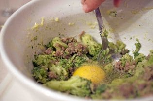 Mixing an egg with other ingredients