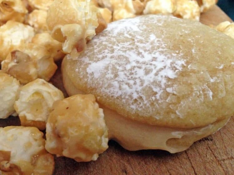 A whoopie pie surrounded by caramel corn.