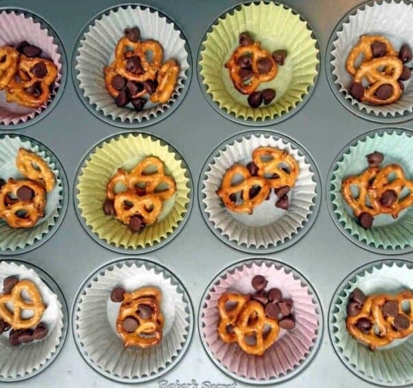 Muffin liners with pretzels and chocolate chips.