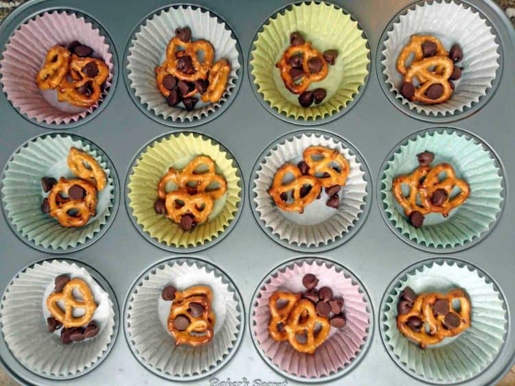 Muffin liners with pretzels and chocolate chips.