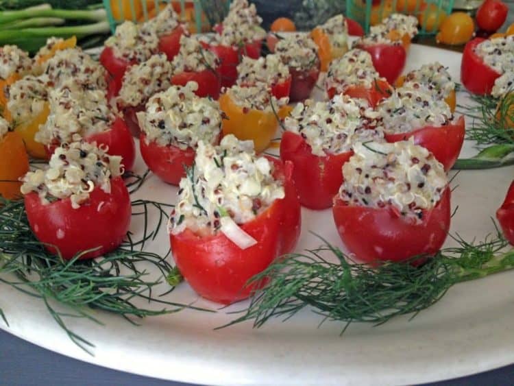 A plate of food, with cherry tomatoes.