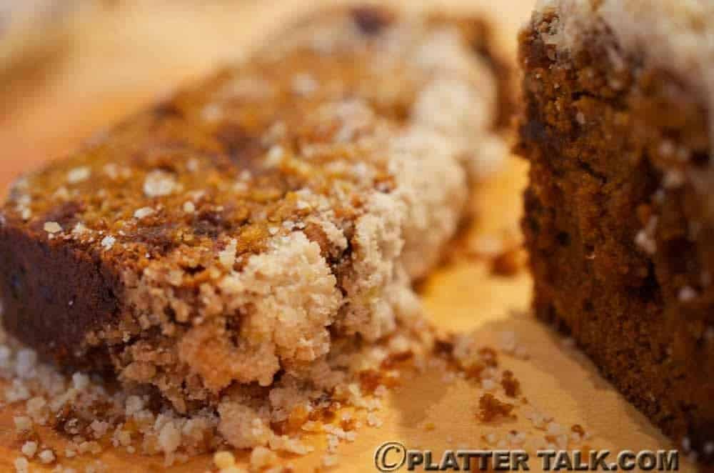 A close up of a piece of pumpkin bread.