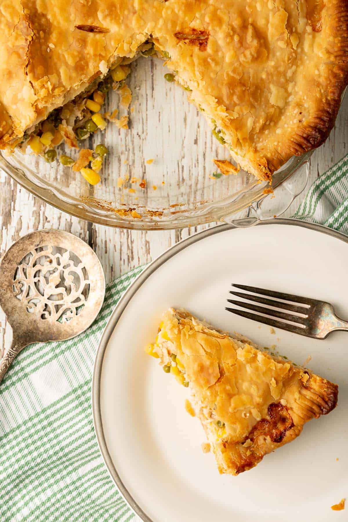 A serving of chicken pot pie on a small white plate.
